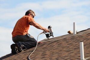 Homeowner viewing roof shingles and gutters from the ground after a seasonal inspection.
